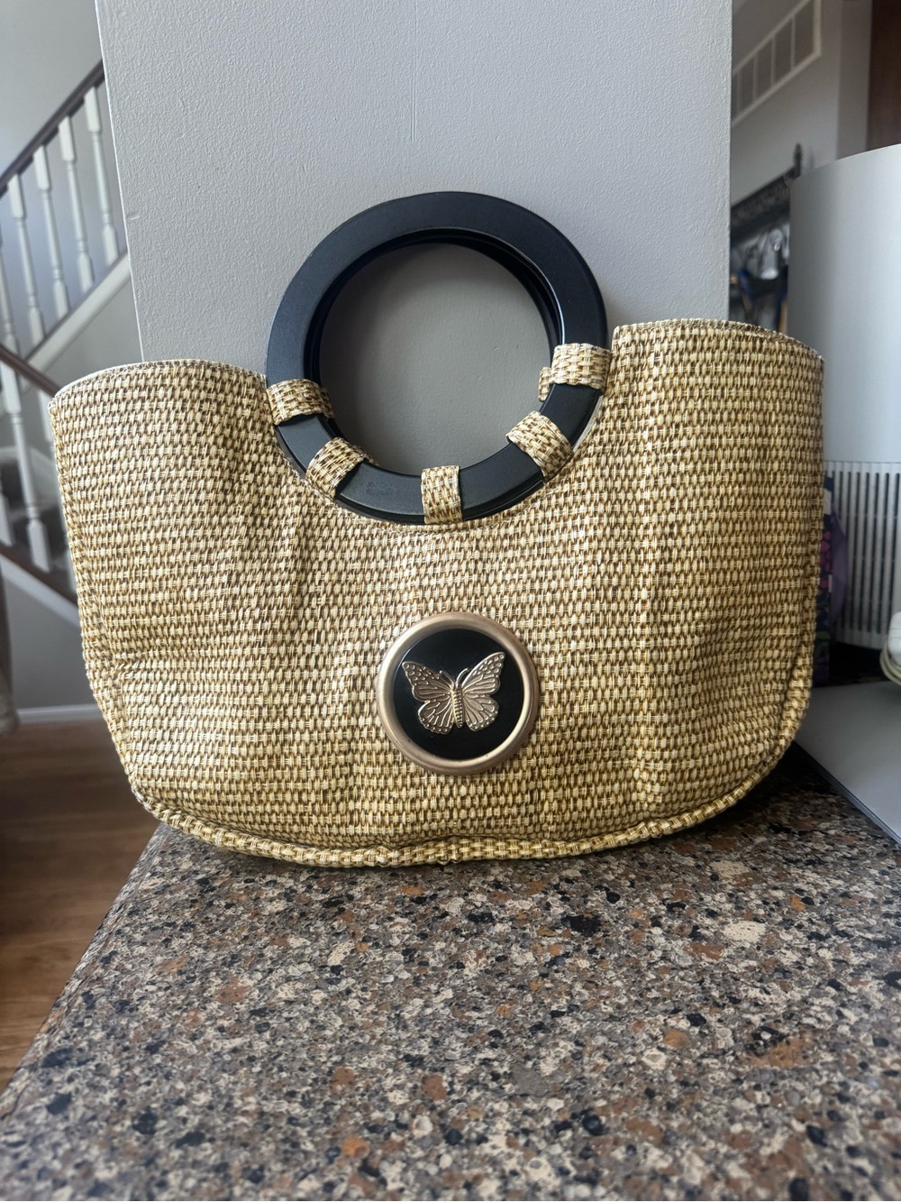 Braciano Woven Straw Tote with Black Ring Handles and Butterfly Accent
